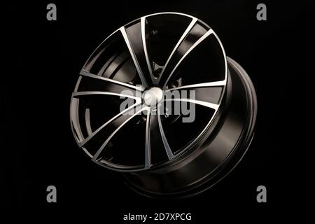 alloy wheel black with a white groove, 6 beams for SUVs and crossovers, close-up on a black background Stock Photo