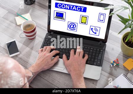 Contact concept shown on a laptop used by a man Stock Photo