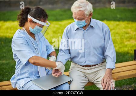 Pulse being taking on an aged man wrist Stock Photo