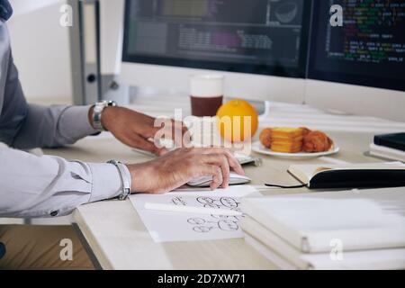 Software developer working on computer Stock Photo