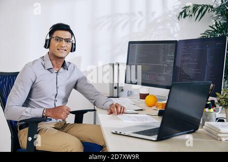 Software developer at his desk Stock Photo
