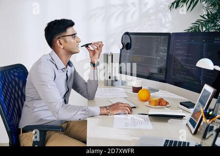 Programmer recording voice message Stock Photo