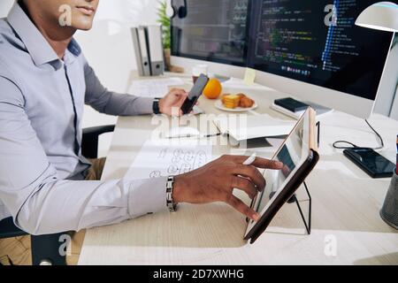 Software developer checking data Stock Photo