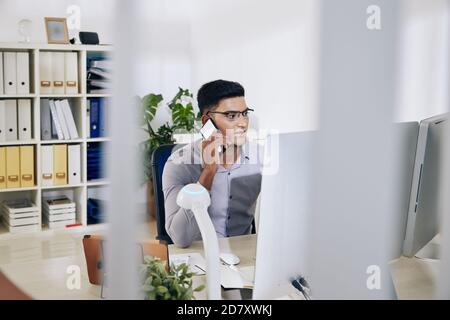 Indian entrepreneur talking on phone Stock Photo