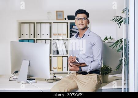 Young Indian entrepreneur with tablet Stock Photo