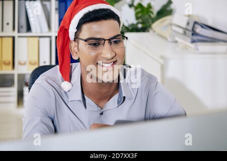 Software developer reading work chat Stock Photo