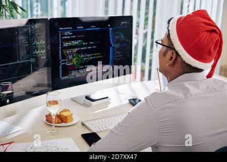 Working in office on Christmas eve Stock Photo