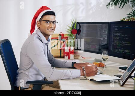 Programmer working on Christmas Stock Photo