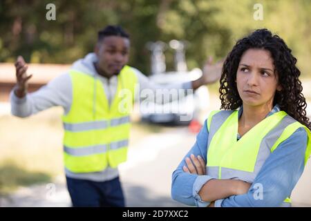unhappy couple after a car crash Stock Photo