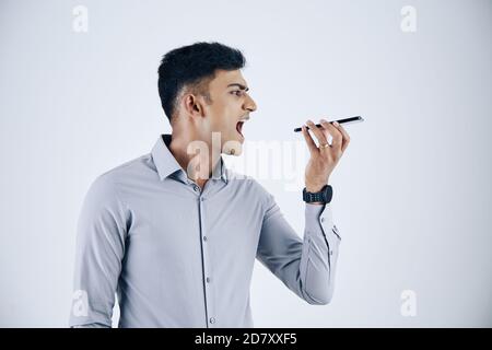 Entrepreneur shouting in microphone Stock Photo