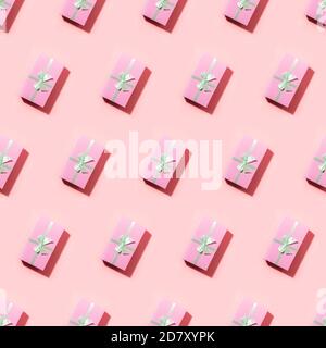 Seamless pattern of many pink gift boxes with shadow on pink. Stock Photo
