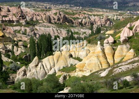 A view of Pigeon Valley showing fairy chimneys and coloured rock formations. It is located adjacent to Uchisar in the Cappadocia region of Turkey. Stock Photo