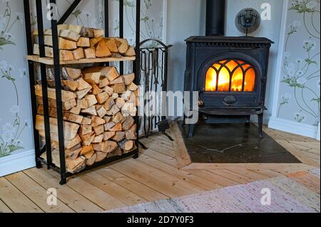 cast iron stove with small fan on top Stock Photo