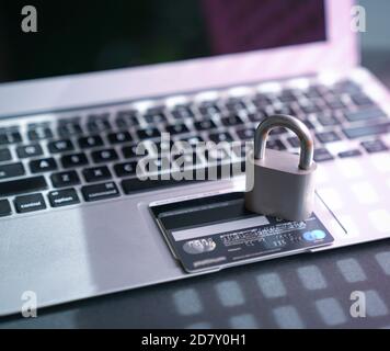 Padlock and credit cards on top of computer keyboard. Internet or cyber security concept. Stock Photo