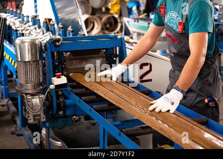 Worker at factory measures works metal production industrial Stock Photo