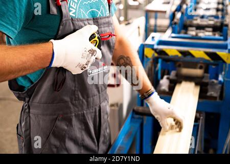 Worker at factory measures works metal production industrial Stock Photo