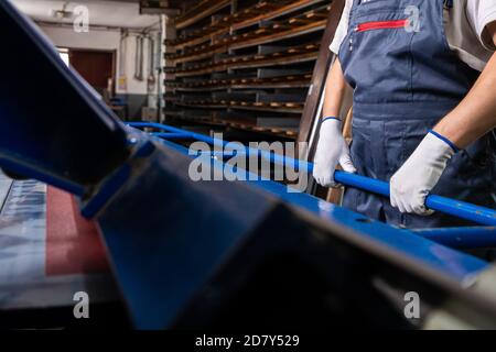Worker at factory measures works metal production industrial Stock Photo