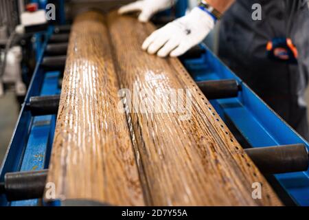 Worker at factory measures works metal production industrial Stock Photo