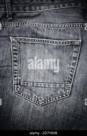 Back pocket on old worn jeans Stock Photo