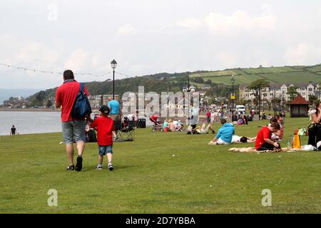 Largs, Ayrshire, Scotland, UK  Seafront area people enjoying the weather Stock Photo