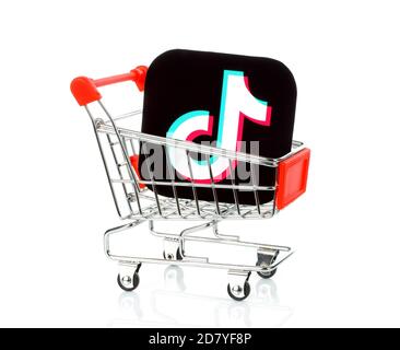 Kiev, Ukraine - August 25, 2020: TikTok icon printed on paper and put into shopping cart. TikTok is a video-sharing social networking service owned by Stock Photo