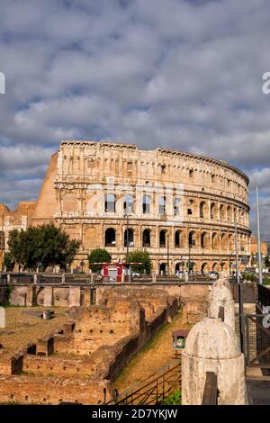 The Colosseum and Ludus Magnus ancient gladiatorial school ruins in city of Rome in Italy Stock Photo