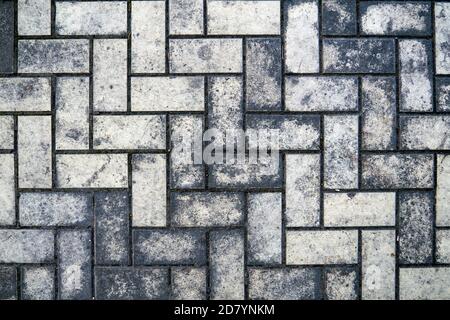 Top view of a dirty gray brick pavement Stock Photo