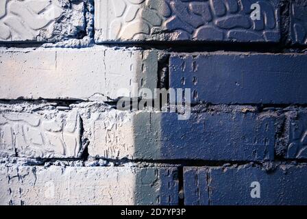 grey and blue color painted brick wall texture Stock Photo