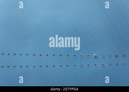 Blue metal wall background texture with rivets Stock Photo