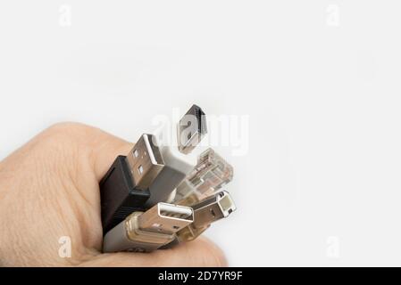 Computer cables in the hand on a white Stock Photo