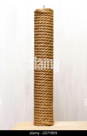 cat tree and furniture, sisal rope cat scratching post on beige carpet Stock Photo