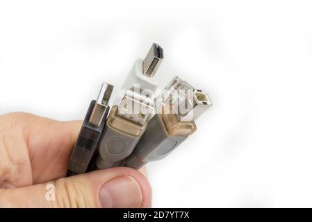 Computer cables in the hand on a white Stock Photo
