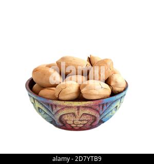 bowl with pecan nuts in shell isolated on white background Stock Photo