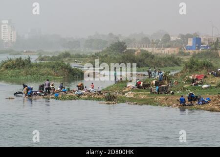 View of african women washing Clothes, and themselves in the Niger River, Mali, Bamako, West Africa Stock Photo