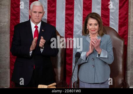 U.S. Vice President Mike Pence and Speaker of the House Nancy Pelosi, Democrat from California, clap as NATO Secretary General Jens Stoltenberg delivers remarks to a joint session of Congress on Capitol Hill on Wednesday April 3, 2019. Credit: Alex Edelman/The Photo Access Stock Photo