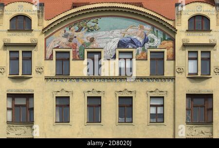 Allegory of music depicted in the majolica mosaic designed by Czech painter Karel Ludvík Klusáček on the House of the Hlahol Choir Society on the embankment of the Vltava River in Nové Město (New Town) in Prague, Czech Republic. The Art Nouveau building designed by Czech architects František Schlaffer and Josef Fanta with stucco decoration by Czech sculptor Josef Pekárek was built from 1902 to 1905 in what is now known as Masarykovo Embankment. Stock Photo