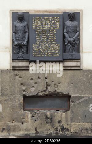 Commemorative plaque devoted to Czechoslovak paratroopers and Orthodox clergymen over the window to the crypt of the Cathedral of Saints Cyril and Methodius in Resslova Street in Nové Město (New Town) in Prague, Czech Republic. The plaque designed by Czech sculptor František Bělský was unveiled in 1947 in honour of Czechoslovak paratroopers fallen during the Operation Anthropoid as well of executed clergymen of the Czechoslovak Orthodox Church who offered refuge for the paratroopers in the crypt of the cathedral in 1942. Stock Photo