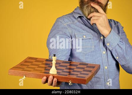 Board game. level up your iq. bearded man hold chess board. intelligence quotient concept. human brain working. brainstorming concept. play chess tournament. Intelligence level measurement. Stock Photo