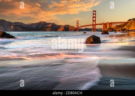 Sunset at Baker Beach with Golden Gate Bridge in the background, San Francisco, California, USA Stock Photo