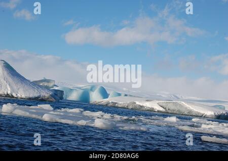 Jokulsarlon glacier lagoon in Iceland in winter time with icebergs and blue sky Stock Photo