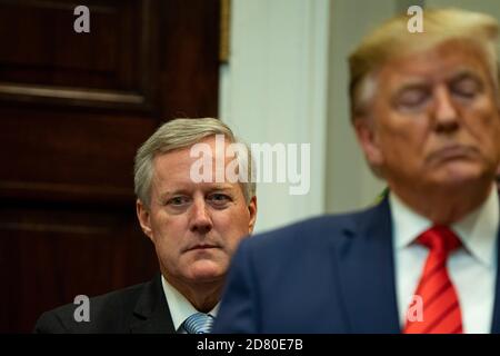 Representative Mark Meadows, a Republican from North Carolina, looks on as U.S. President Donald Trump speaks during a ceremony to sign Executive Orders on transparency in Federal guidance and enforcement at the White House in Washington, D.C., U.S., on Wednesday, October 9, 2019. The order aims to weed out unclear federal regulations. Trump then answered questions and defended his decision not to cooperate with the ongoing impeachment investigation. He also warned Turkish President Recep Tayyip Erdoğan not to take aggressive action in Northern Syria. Trump threatened economic sanctions agains Stock Photo