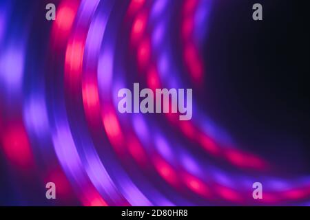 Abstract swirl tunnel with violet light on a background pattern textured for design. Stock Photo