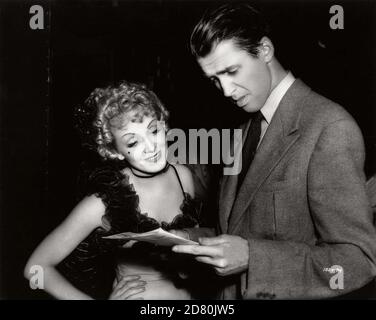 Destry Rides Again Year : 1939 USA Réalisateur : George Marshall Marlene Dietrich, James Stewart on the set Stock Photo