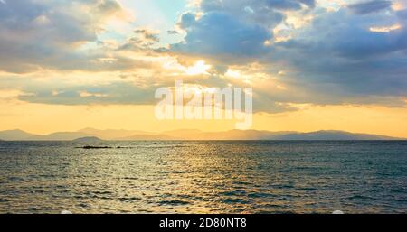 Panoramic view with the sea, clouds and sunbeams in the evening. Landscape Stock Photo