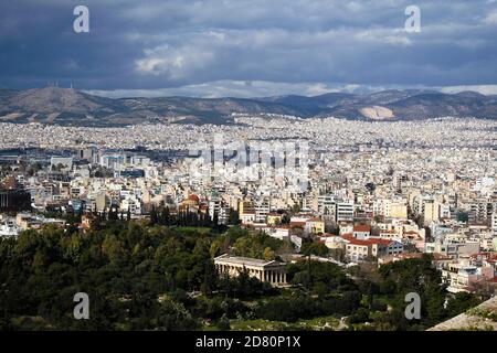 Partial view of Athens city from the Acropolis hill with the temple of Hephaestus in the foreground - Athens, Greece, February 2 2020. Stock Photo