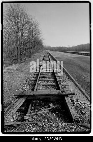 The remains of the Railway Line into Buchenwald . The Platform (seen here) is the beginning of the infamous Caracho Way (Carachoweg) which all prisoners had to use to walk to the camp. Caracho is a Spanish prison slang word for 'Double Time' and was so named by Spanish Communist prisoners who helped to build the railway and who were captured fighting against Franco in the Spanish Civil War.  Buchenwald; literally beech forest) was a Nazi concentration camp established on Ettersberg hill near Weimar, Germany, in July 1937. On the main gate, the motto Jedem das Seine (English: 'To each his own') Stock Photo