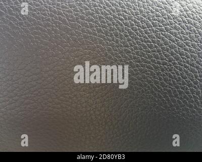 Textured beige grey leather background with convex cells. Stock Photo