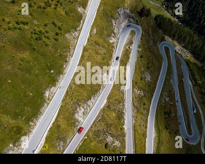 Aerial top view on scenic curvy mountain pass road to the Timmelsjoch at the border of Italy and Austria in the Alps