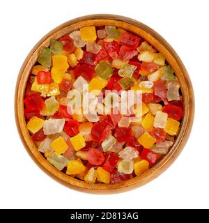 Diced candied fruits in a wooden bowl. Peel of oranges, papayas and succade, preserved and sweetened in sugar syrup, used as a filling or as a garnish Stock Photo