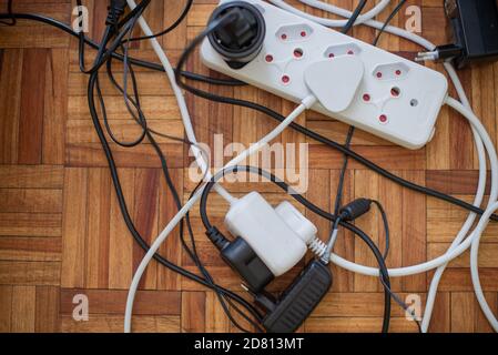 Close up shot of collection of plugs attached to lead Stock Photo